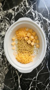 Crockpot Mac and Cheese Velveeta ingredients beginning to melt Recipe focus: supper ideas.