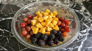 Fall Fruit Salad Thanksgiving Sides fruit coated with orange cinnamon dressing