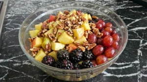 Fall Fruit Salad Thanksgiving Sides finished with pecans and cinnamon dressing