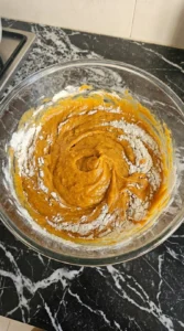 Friendsgiving Cake batter mixing with pumpkin and warm spices Recipe focus: friendsgiving dish ideas.