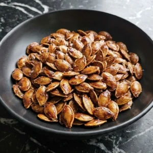 Honey Roasted Pumpkin Seeds with a glossy amber honey glaze and crisp caramelized edges Recipe focus: how to make honey roasted pumpkin seeds.