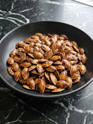 Honey Roasted Pumpkin Seeds with a glossy amber honey glaze and crisp caramelized edges Recipe focus: how to make honey roasted pumpkin seeds.