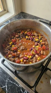 7 Can Taco Soup simmering with thick tomato broth and beans Recipe focus: 7 can taco soup recipe easy.