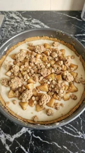 Apple Crisp Cheesecake layered with creamy filling, cinnamon apples and oat streusel Recipe focus: apple crisp recipe easy simple.