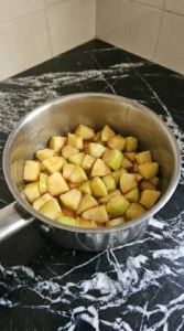 Cooking cinnamon apples for Apple Crisp Mini Cheesecake until glossy and lightly softened Recipe focus: mini apple crisp cheesecake.