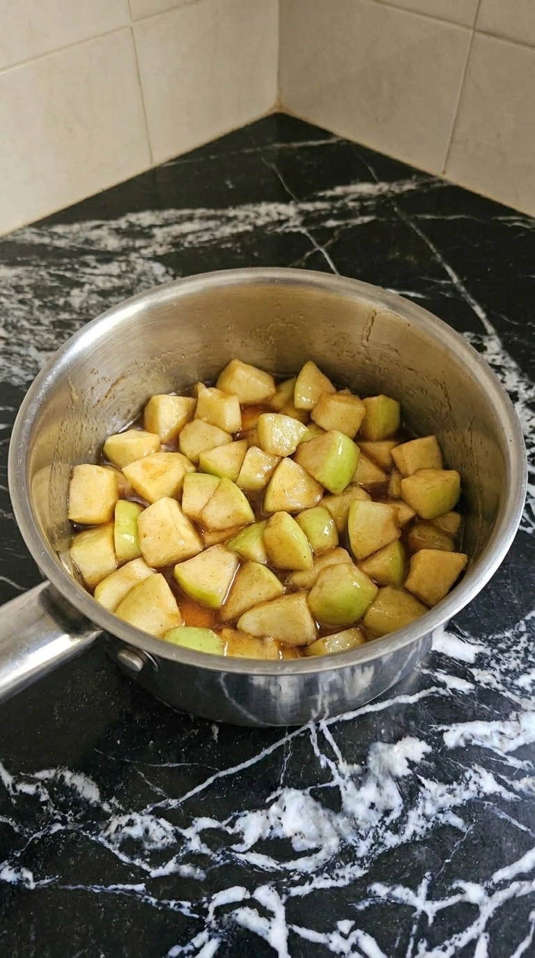 Cooking cinnamon apples for Apple Crisp Mini Cheesecake until glossy and lightly softened Recipe focus: mini apple crisp cheesecake.