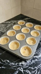 Baked graham cracker crusts for Apple Crisp Mini Cheesecake in twelve muffin liners Recipe focus: mini apple crisp cheesecake.