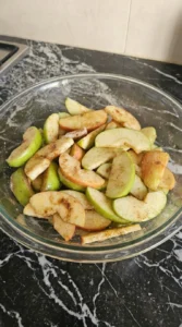 Apple Crisp with Oatmeal Crumble step 1: slice and coat the apples with visible texture changes Recipe focus: best apple crumble recipe.