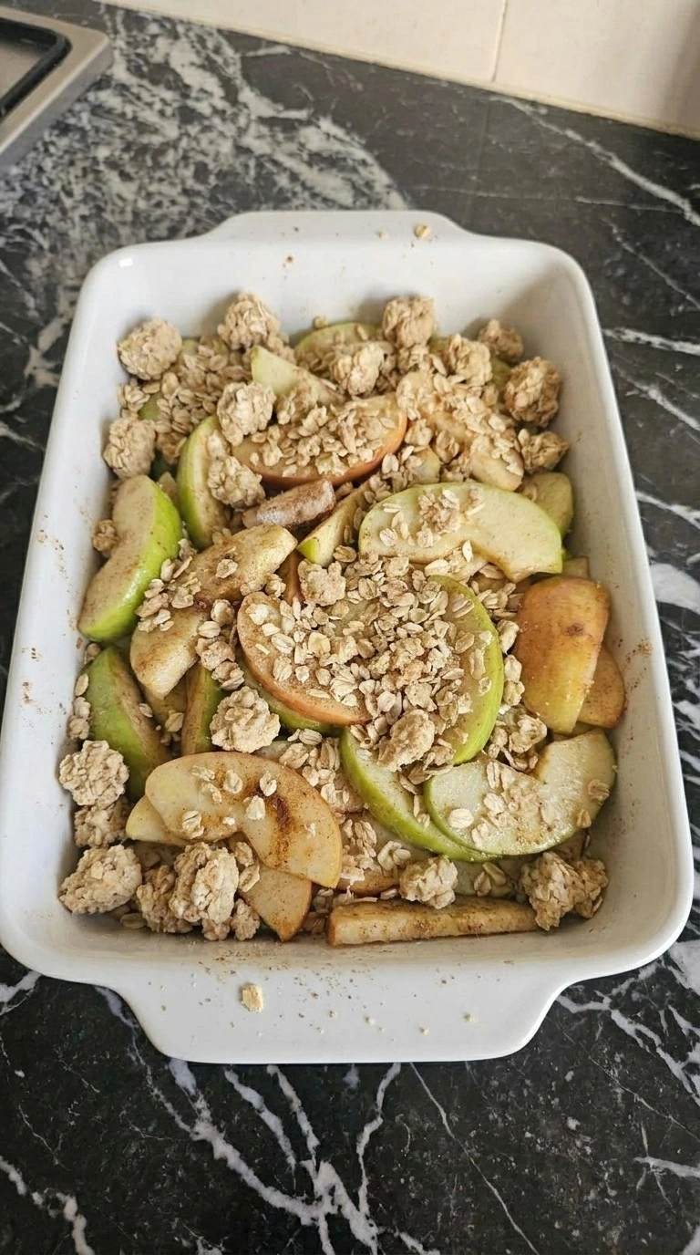 Apple Crisp with Oatmeal Crumble step 3: layer the apples and crumble with visible texture changes Recipe focus: easy apple crisp with pie filling.