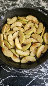 Cooking cinnamon apples for Carmel Apple Trifle Fall Desserts until glossy and tender