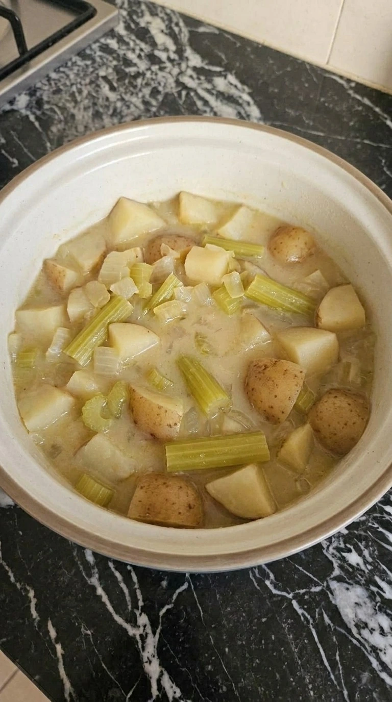 Crockpot Potato Soup step 2 showing softened potatoes in the slow cooker Recipe focus: potato soup crock pot.