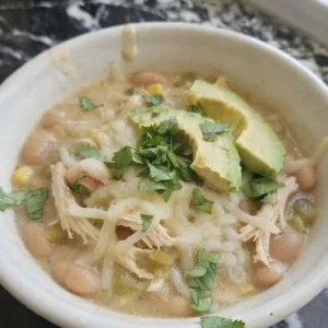 Crockpot White Chicken Chili in a bowl with tender chicken and creamy beans Recipe focus: chicken chili recipe.