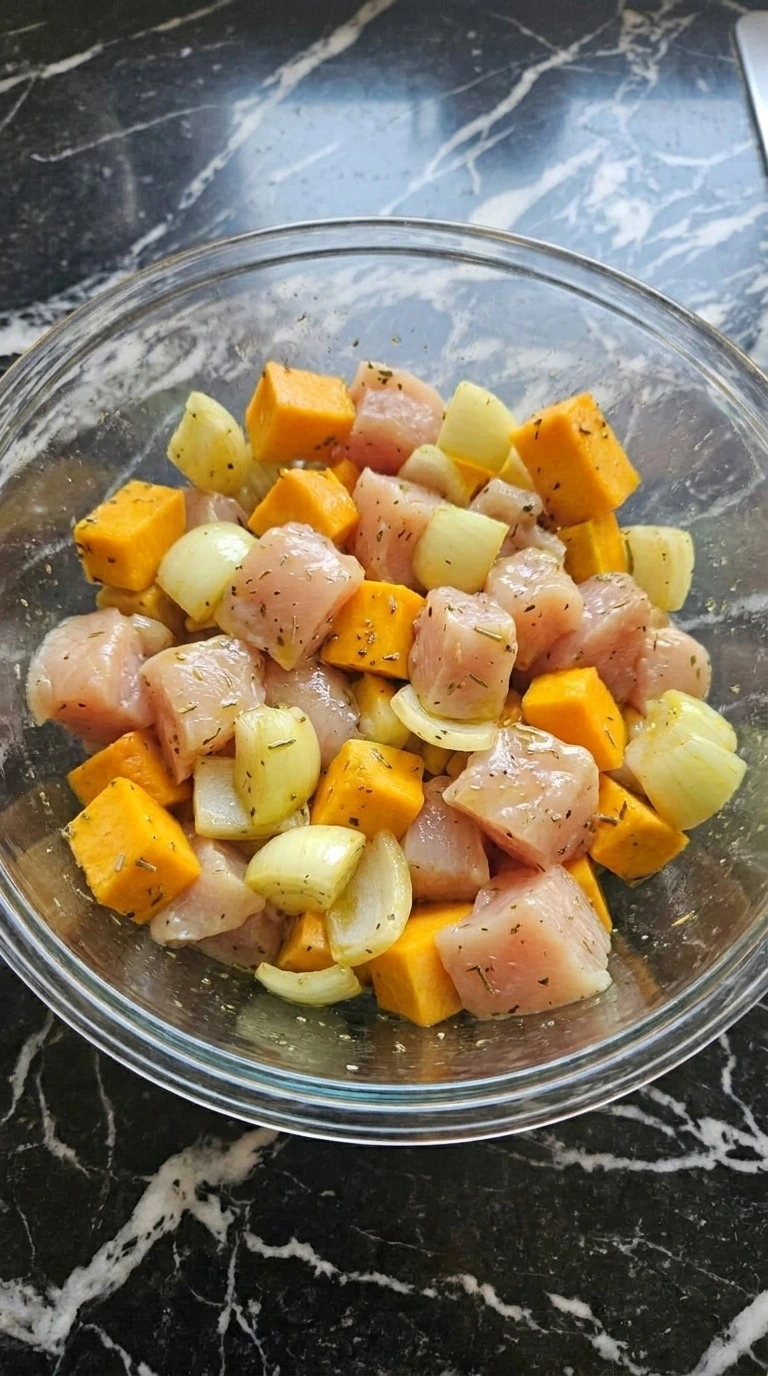 Fall Casserole for Dinner chicken and vegetables being mixed before baking Recipe focus: fall sunday dinner ideas.