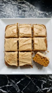 Brown butter cream cheese frosting spread over Fall Desserts for People Who Hate Pumpkin apple carrot cake