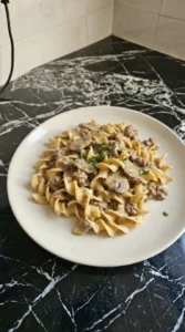 Ground Beef Stroganoff plated portion with creamy noodles beef and mushrooms Recipe focus: beef stroganoff with ground beef.