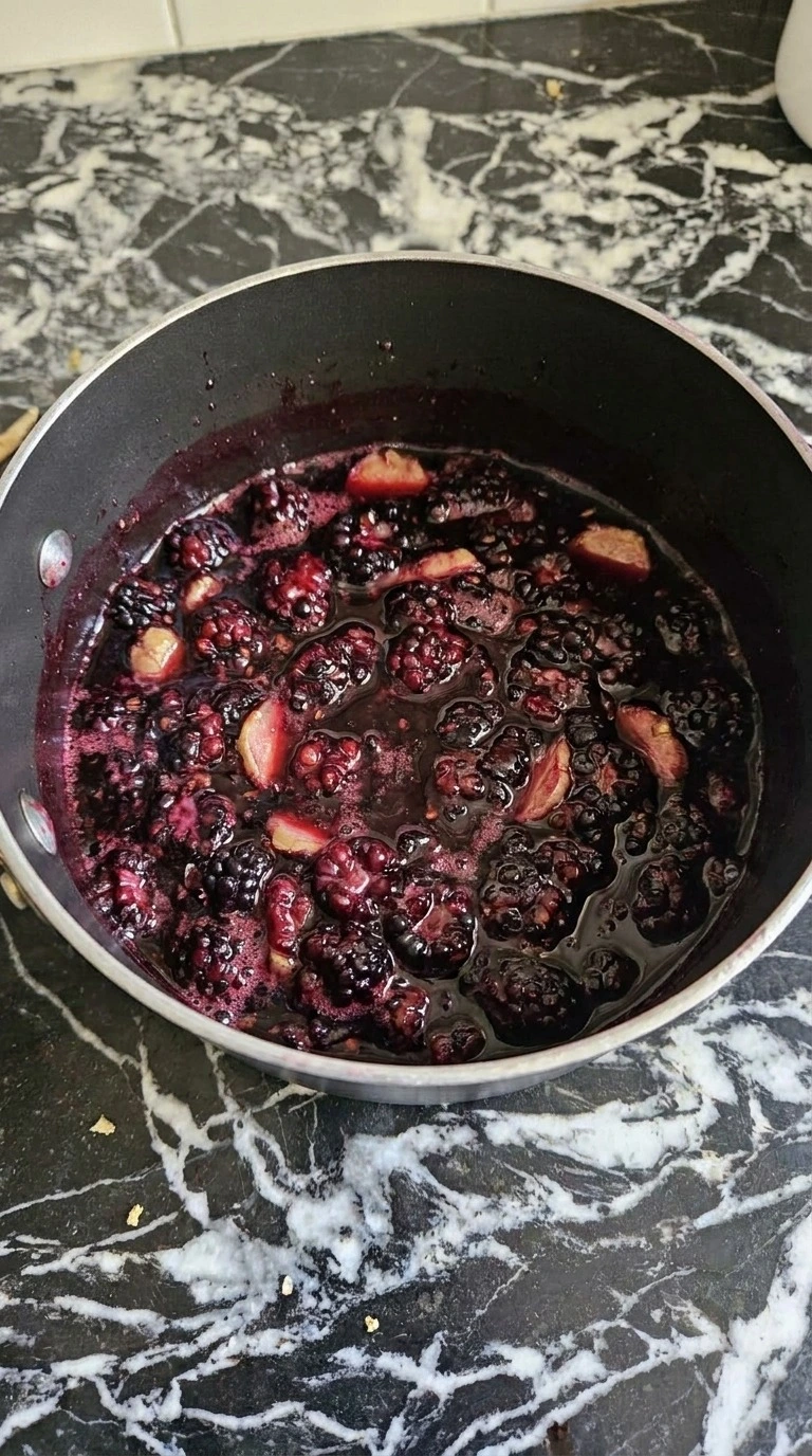 Halloween Cocktails for a Crowd blackberry ginger syrup simmering deep purple with collapsed berries Recipe focus: easy halloween cocktails for a crowd.