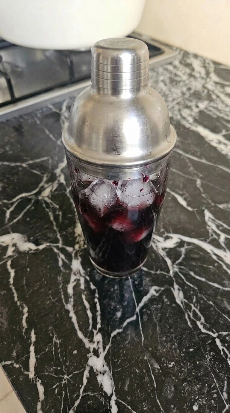 Shaking the dark mixture for Halloween Cocktails Vodka until icy and nearly black Recipe focus: halloween cocktails easy vodka.