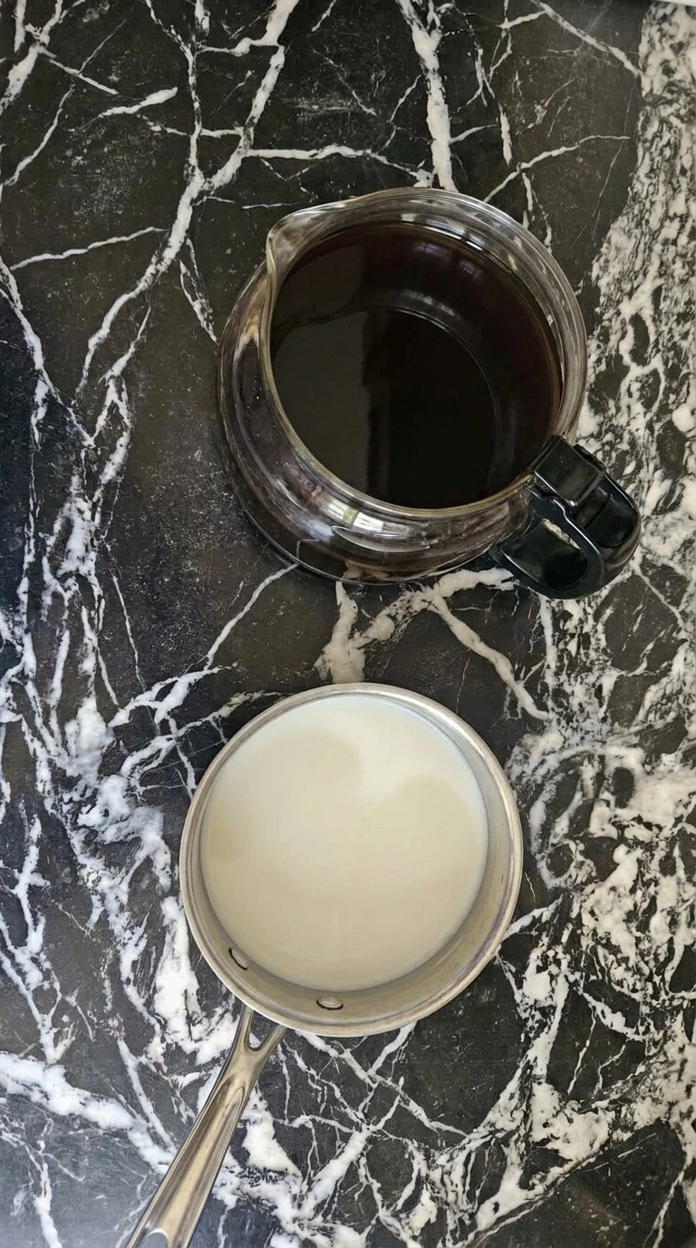 Halloween Coffee Bar dark roast coffee brewed strong with warm whole milk ready for assembly Recipe focus: halloween cafe.