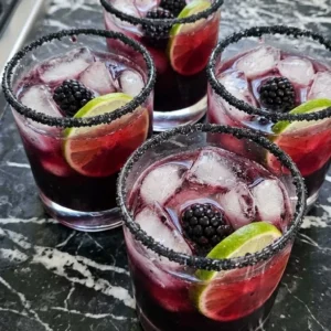 Halloween Drinks Alcohol Cocktails served as dark berry vodka drinks with black sugar rims and fresh Recipe focus: halloween drinks alcohol cocktails easy.