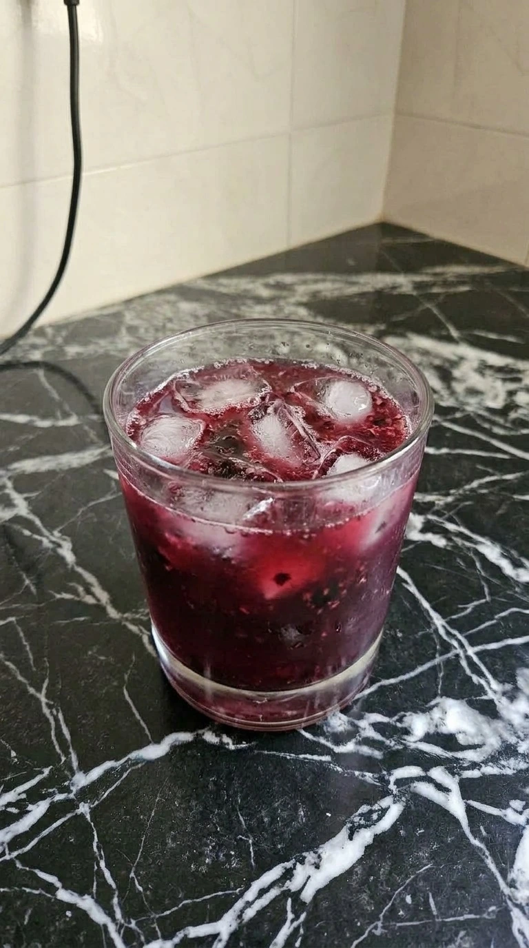 Halloween Drinks Alcohol Cocktails step showing deep ruby vodka berry mixture shaken with ice Recipe focus: halloween drinks alcohol cocktails easy.