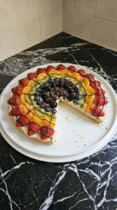 Halloween Fruit Pizza finished with fresh fruit and an irregular semisweet chocolate spiderweb Recipe focus: fruit pizza designs.