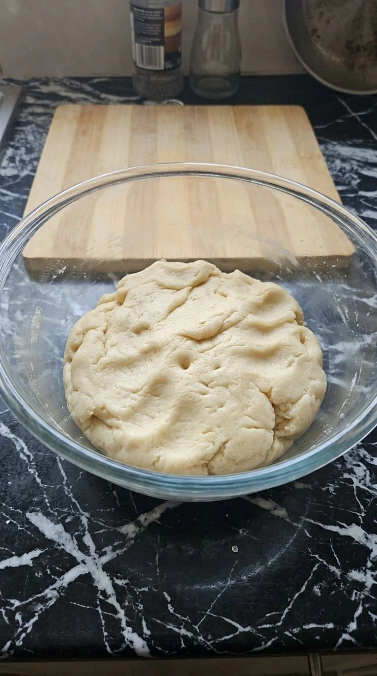 Halloween Fruit Pizza Sugar Cookie dough mixed until thick and pale in a large clear bowl