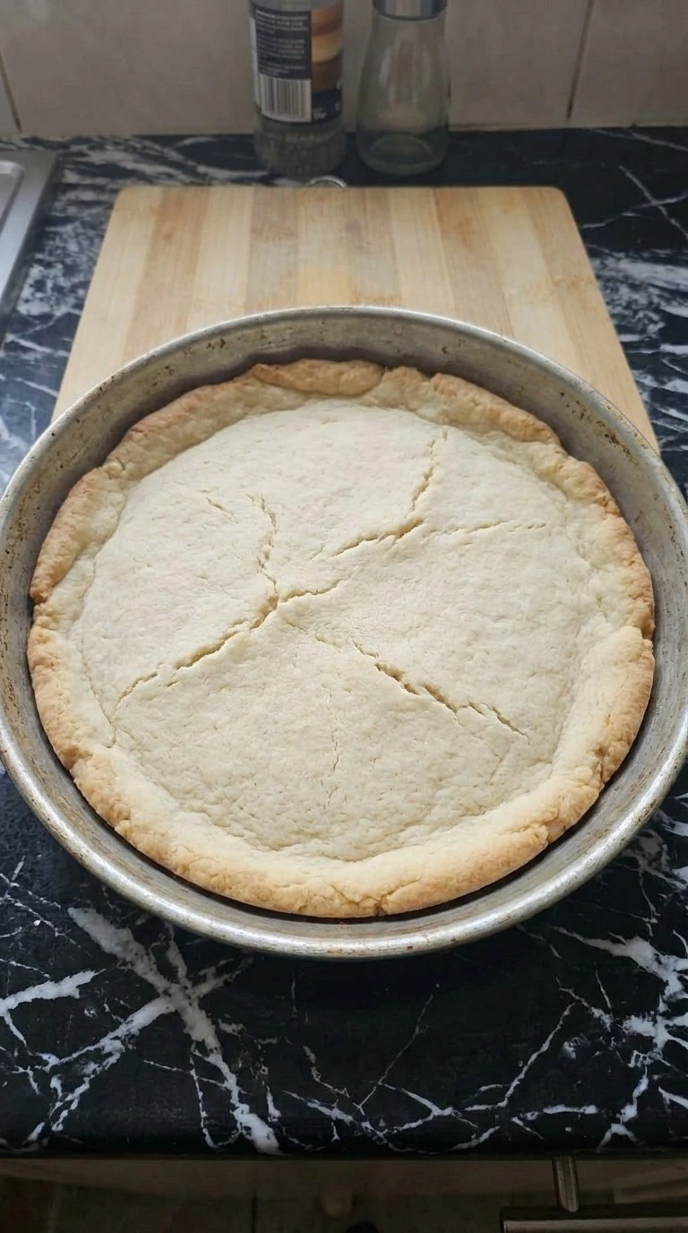 Halloween Fruit Pizza Sugar Cookie crust baked with a pale center and lightly golden uneven edges