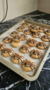 Halloween Peanut Butter Cookies decorated with chocolate spider legs and candy eyeballs Recipe focus: peanut butter cookies halloween.