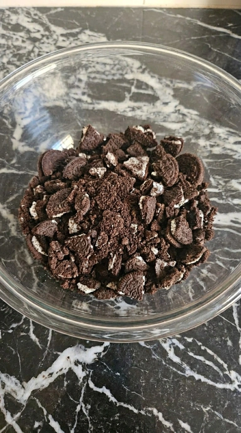 Halloween Pudding Dirt Cups crushed chocolate cookies forming dirt crumbs Recipe focus: how to make halloween Recipe focus: halloween dirt pudding cups.