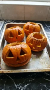 Halloween Pumpkin Carving Creative step with four carved sugar pumpkins partially roasted and still firm Recipe focus: halloween pumpkin carving ideas creative.