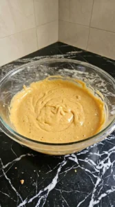 Halloween Pumpkin Carving Stencils step showing thick spiced pumpkin cookie dough after folding