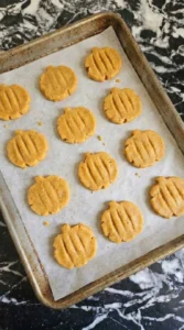 Halloween Pumpkin Cookies baked with lightly golden edges and soft orange centers Recipe focus: pumpkin cookies halloween.