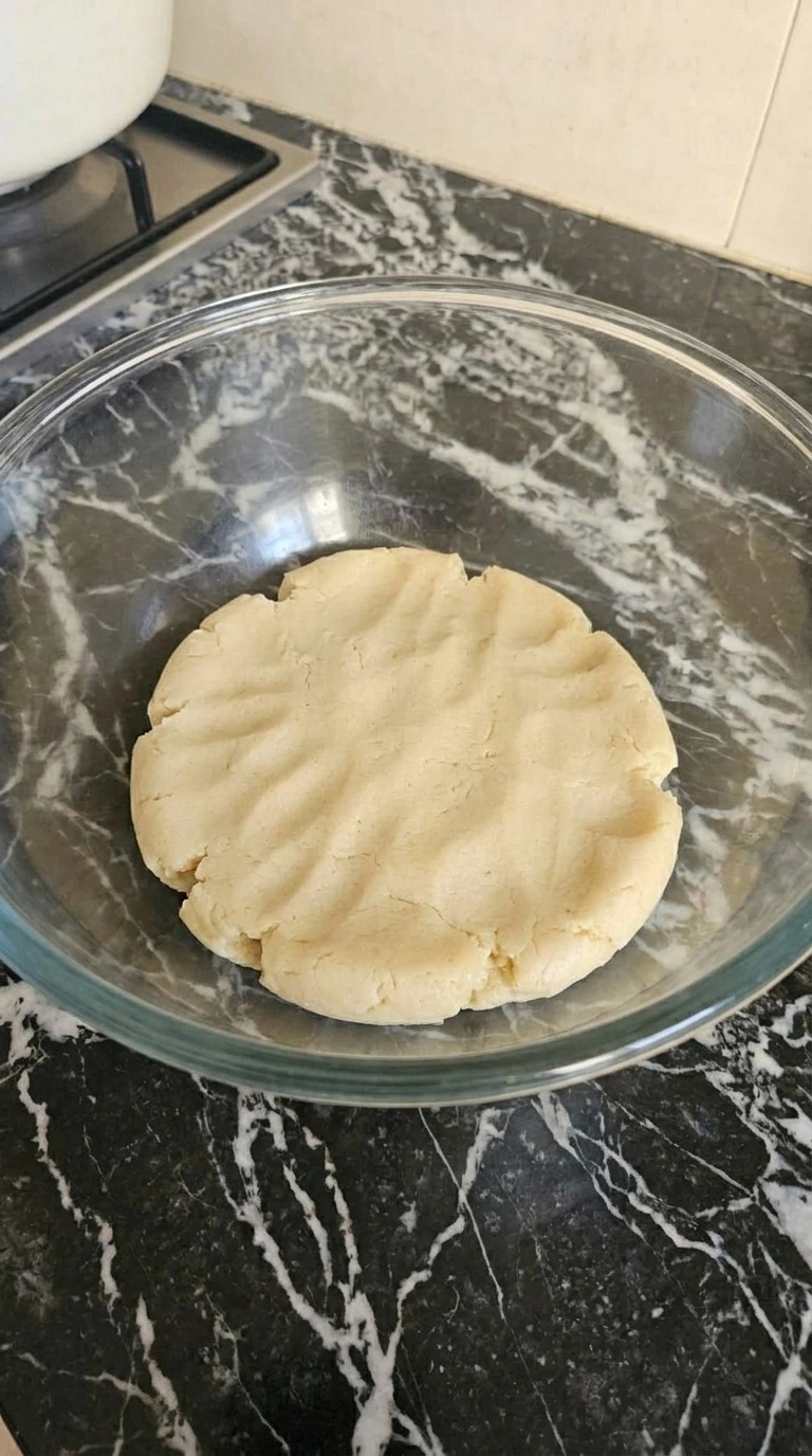 Halloween Pumpkin Designs step showing firm pale sugar cookie dough after mixing and chilling