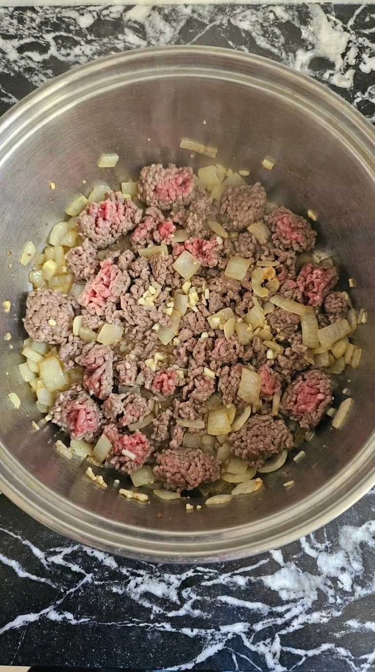 One Pot Lasagna Soup beef and onions browning with garlic in the first cooking stage Recipe focus: lasagna soup recipe.