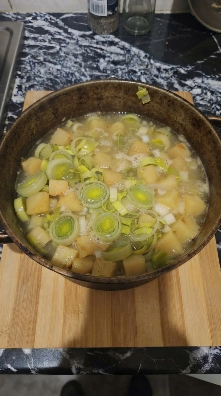 Potato Leek Soup step 3 simmering with tender potatoes and leeks Recipe focus: potato and leek soup.