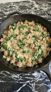Pumpkin for Halloween filling with plump long grain white rice sausage and wilted baby spinach. Recipe focus: halloween pumpkin ideas.