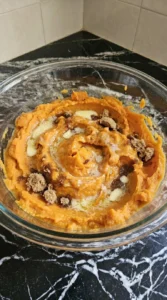Sweet Potato Casserole with Marshmallows mashed filling being mixed Recipe focus: best sweet potato casserole.
