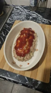 Turkey Meatloaf loaf shaped with ketchup topping before baking Recipe focus: meatloaf recipes.