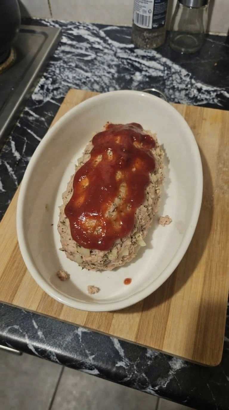Turkey Meatloaf loaf shaped with ketchup topping before baking Recipe focus: meatloaf recipes.