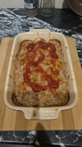 Turkey Meatloaf baking with browned edges and ketchup crust forming Recipe focus: meatloaf recipes easy.