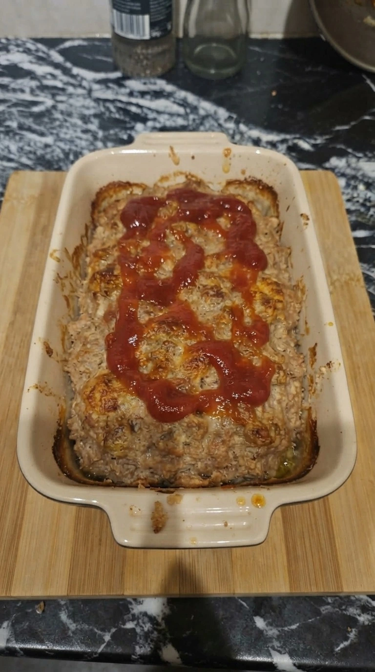 Turkey Meatloaf baking with browned edges and ketchup crust forming Recipe focus: meatloaf recipes easy.