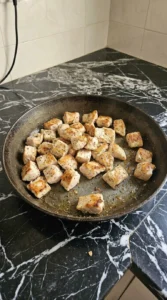 White Chicken Lasagna Soup chicken pieces with golden edges before soup assembly Recipe focus: white lasagna soup recipe.