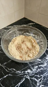 Almond Flour Pumpkin Bread dry ingredients whisked into an even tan mixture with cinnamon specks Recipe focus: low carb pumpkin bread.