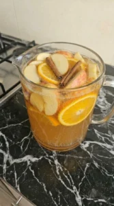 Apple Cider Sangria with bubbles fruit slices and sparkling finish Recipe focus: apple cider sangria recipe.