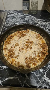 Biscuits and Gravy Breakfast Casserole sausage gravy base being prepared Recipe focus: overnight breakfast casserole.