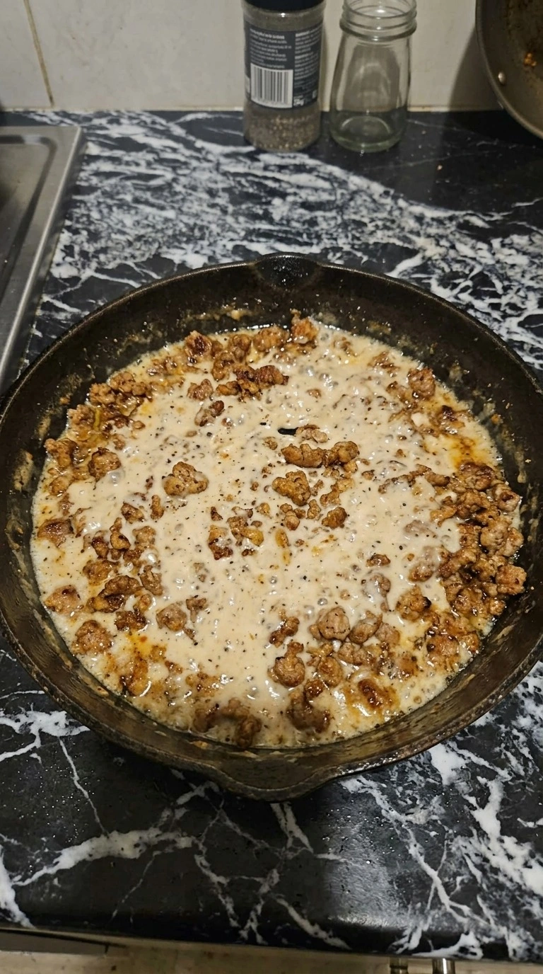 Biscuits and Gravy Breakfast Casserole sausage gravy base being prepared Recipe focus: overnight breakfast casserole.