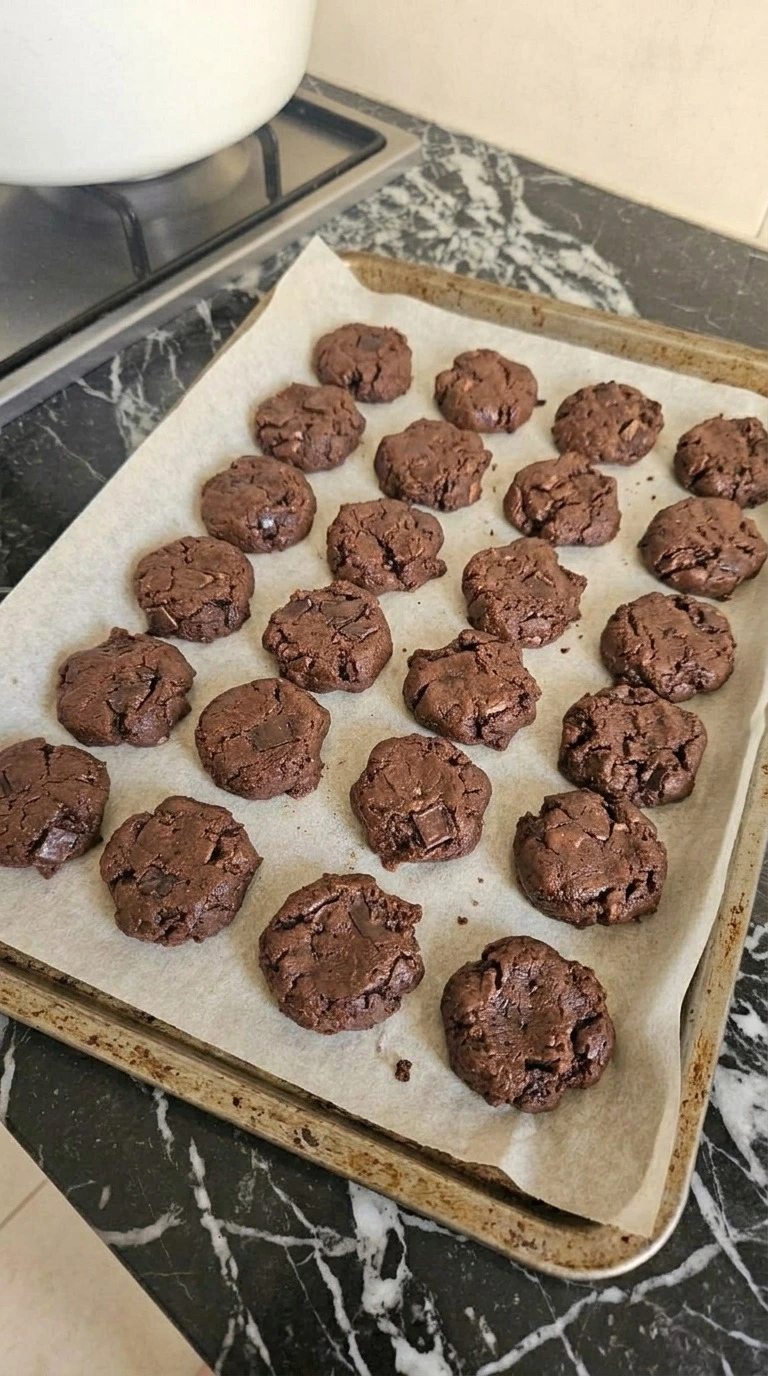 Chewy Chocolate Gingerbread Cookies baking with cracked tops and soft centers Recipe focus: chewy chocolate gingerbread cookies martha stewart.
