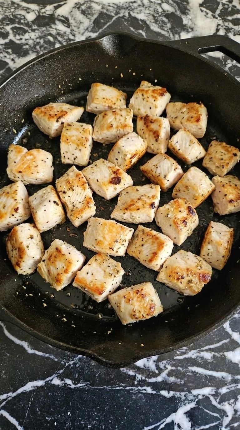 Golden seared chicken breast pieces for Chicken Alfredo Bake Recipe focus: easy chicken alfredo bake.