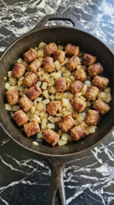 Crockpot Breakfast Casserole sausage browning with onion pieces Recipe focus: overnight breakfast casserole.