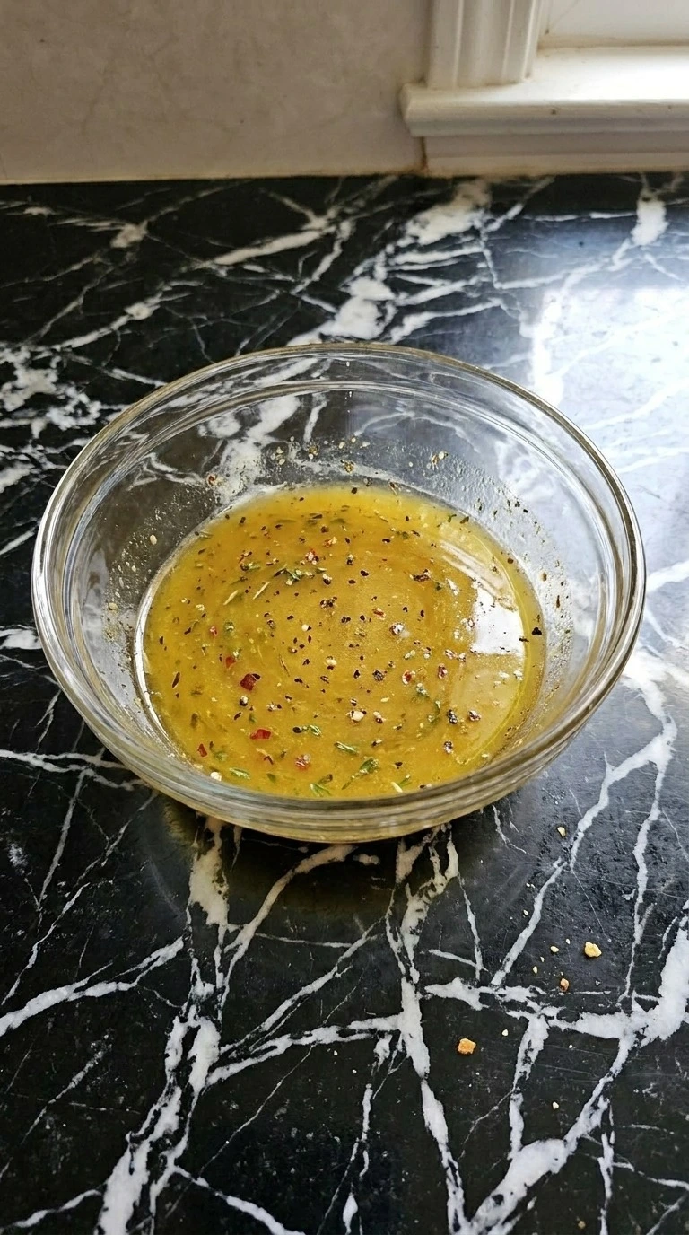Fall Harvest Salad maple dressing blended in a small bowl Recipe focus: fall salad.
